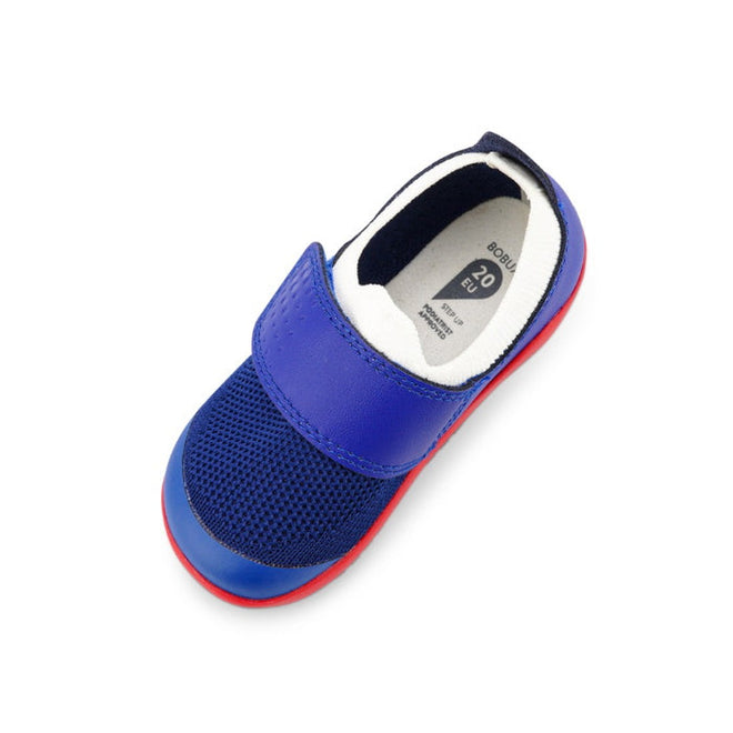 The Bobux Step Up SU Dimension III Blueberry First Walker (CLEARANCE, Not Returnable) is a blue and navy children's sneaker with a velcro strap, mesh upper, white lining, red sole, and toe protection shown on a white background., 9420068533042, 9420068533059, 9420068533066, 9420068533073