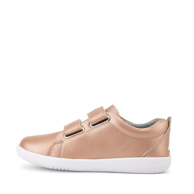 The Bobux Kids + Plus Grass Court Rose Gold Velcro Trainers 832455 feature a leather upper, double velcro straps, white rubber sole, and slightly padded collar, shown in side view with a sleek rose gold design., 9420071315741, 9420071315758, 9420071315765, 9420071315772, 9420071315789, 9420071315802, 9420071315796