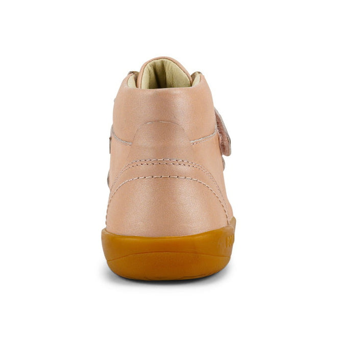 A rear view of the Bobux Kids Plus KP Timber Boot Dusk Pearl Pink 832918 shows smooth pearl pink leather, visible stitching, a soft padded collar, and a light brown sole inspired by Timberland boots, set against a white background., 9420068534308, 9420068534315, 9420068534322, 9420068534339, 9420068534346, timberd32, timberd33