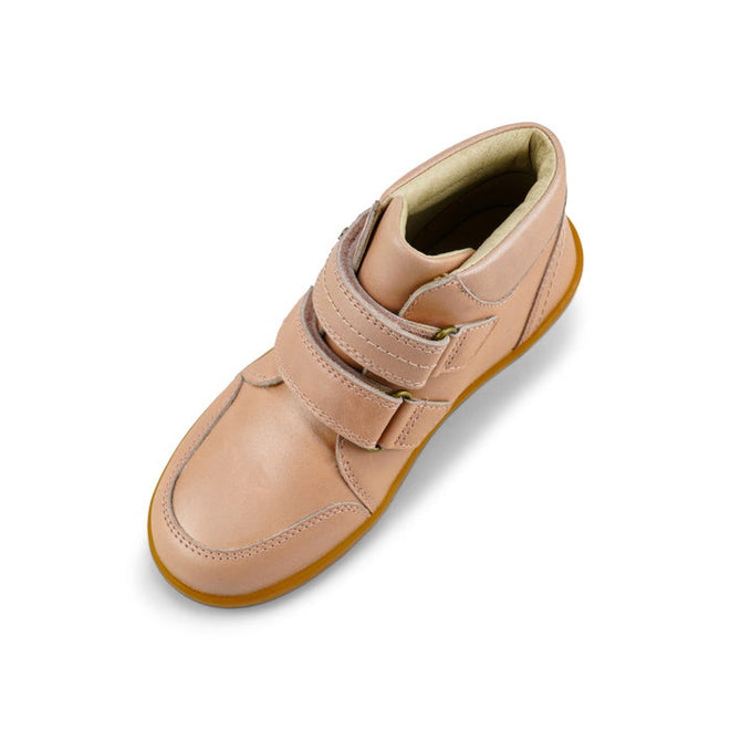 The Bobux Kids Plus KP Timber Boot Dusk Pearl Pink 832918 is a single light pink smooth leather boot with a tan rubber sole and double straps, shown from above at an angle on a white background., 9420068534308, 9420068534315, 9420068534322, 9420068534339, 9420068534346, timberd32, timberd33