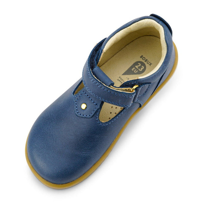 The Bobux IW Iwalk Louise Midnight Blue 633030 is a children’s T Bar shoe with a blue leather upper, tan rubber sole, snap button, and beige inner lining, shown from above at a slight angle., 9420068521841, 9420068521858, 9420068521865, 9420068521872, 9420068521889