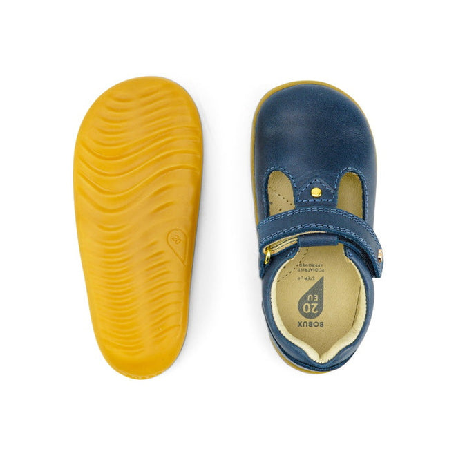 Top and bottom view of the Bobux Step Up T-Bar Louise Midnight Blue 728330 kids’ shoe with a yellow rubber sole, leather upper, strap with gold snap button, and noticeable stitching., 9420068521810, 9420068521827, 9420068521834