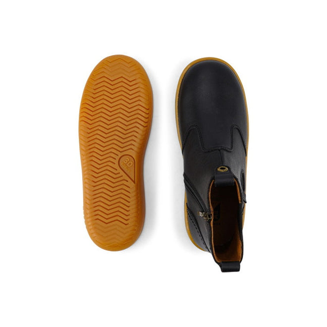 The Bobux Kid+ Jodphur Boot Black 830016Z is a black unisex boot with tan rubber soles. One boot is shown from the top, and the other displays a textured sole for grip., 9420075719811, 9420075719828, 9420075719835, 9420075719842, 9420075719859, 9420075719866, 9420075719873