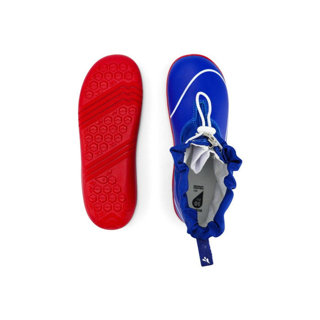 The Bobux Kid+ Splash Boot Waterproof Blueberry 839003 features blue boots with white accents and red textured soles; one boot is shown from the top, the other displays the sole—perfect clearance kids’ footwear for style and comfort., 9420068527911, 9420068527928, 9420068527935, 9420068527942, 9420068527959, 9420068527966, 9420068527973