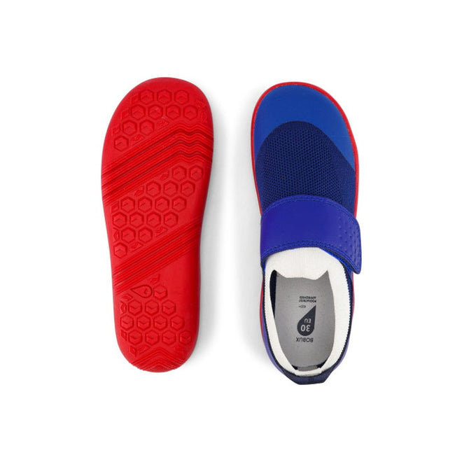 The Bobux Kid+ Lo Dimension III Blueberry 838605 shoes feature blue uppers, a Velcro strap, and bright red soles with a hexagonal pattern. Shown from the top and sole, they highlight flexible performance. Now on clearance., 9420068533134, 9420068533097, 9420068533080, 9420068533103, 9420068533110, 9420068533127, 9420068533141