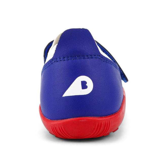 A Bobux Kid+ Lo Dimension III Blueberry 838605 children's shoe with a red sole, seen from the back. The white heel features a teardrop B design. This flexible performance shoe is on clearance and displayed on a plain white background., 9420068533134, 9420068533097, 9420068533080, 9420068533103, 9420068533110, 9420068533127, 9420068533141