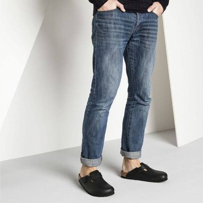 A picture of a man in blue jeans and a black knitted top weariing the Birkenstock boston smooth leather black mule clogs.,
4013871025191,4013871017615,4013871019862,4013871020868,4013871024217,4013871029960,4013871030577,4013871041115,4013871042518,4013871058878,4013871065944,4013871079972, 
