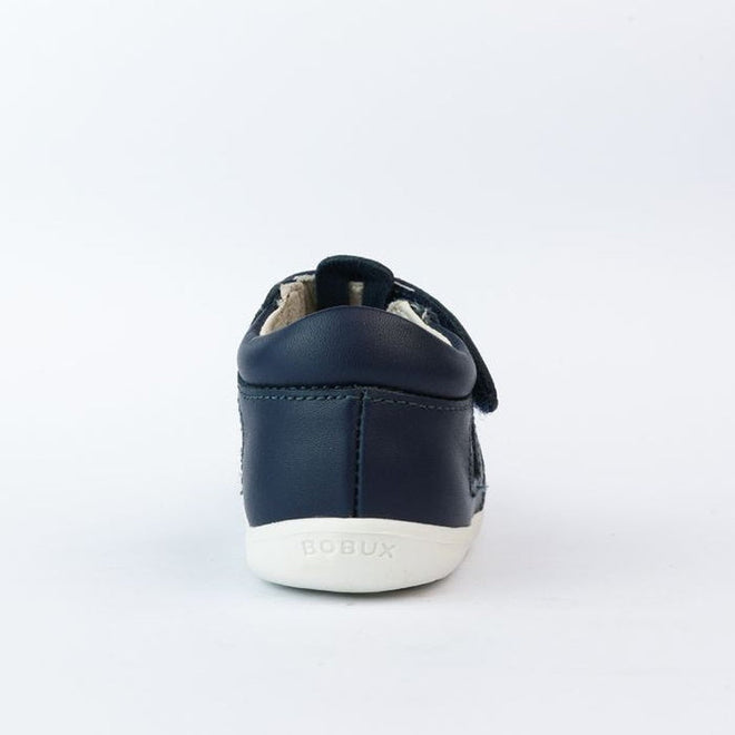 The Bobux Step Up Zap II Navy Closed Toe Sandal 732404 Quick Dry for children is shown from the back, featuring quick-drying leather, a white sole, and BOBUX embossed on the heel against a plain white background., 9420068505476, 9420068505483, 9420068505490, 9420068505469