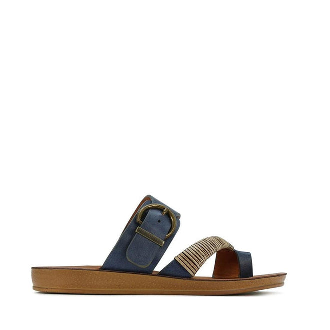 The Los Cabos Bria Blue Light Flexible Sandal Jandal Navy features a brown sole, navy straps, a large metallic buckle, and a beige front accent—ideal for women seeking stylish summer footwear., 236222, 9321191161815, 9321191161822, 9321191161839, 9321191161846, 9321191161853, 9321191161860