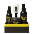 Image of right foot, side on of Dr Martens Shoe Care Kit Ultimate Box-Foot Forward Shoes