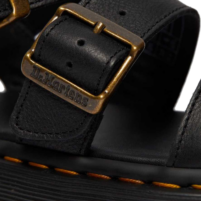 A close up shot of the detailing on the buckle of a Dr Martens Gryphon Quad showing the Dr Martens branding.,
190665318654,
190665318661,
190665318678,
190665318685,
190665318692,
190665318708,
190665318715,