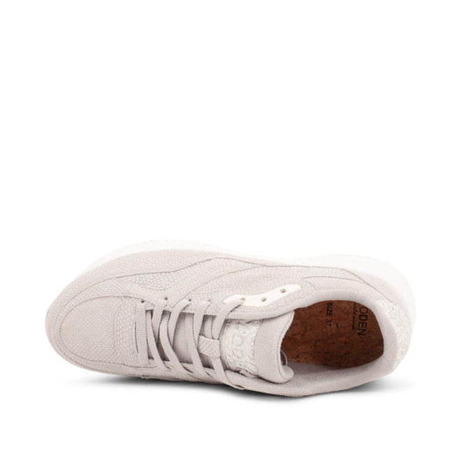 A top view of the Woden - Sophie Snake Suede sneaker in Sea Fog Grey, featuring textured fabric, white laces, a shock-absorbing cork insole, rounded toe, visible upper stitching, and Scandinavian minimalist style., 5713326155754, 5713326155761, 5713326155778, 5713326155785, 5713326155792, 5713326155808