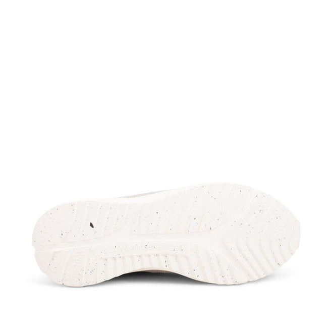 Close-up view of the white outsole of the Woden - Sophie Snake Suede - Sea Fog Grey Womens Sneaker, highlighting its textured grip patterns and subtle speckling, photographed against a plain white background., 5713326155754, 5713326155761, 5713326155778, 5713326155785, 5713326155792, 5713326155808