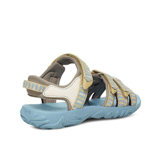 The Teva Girls Active Sandal K Tirra STACKS COCOON features blue-striped quick-dry webbing straps, a blue textured sole, and beige and white accents—seen from the back and side against a white background; perfect for day hikes., 195719341305, 195719341350, 195719341329, 24599, 24600, 24601, 195719341497, 195719341473, 195719341480, 195719341466