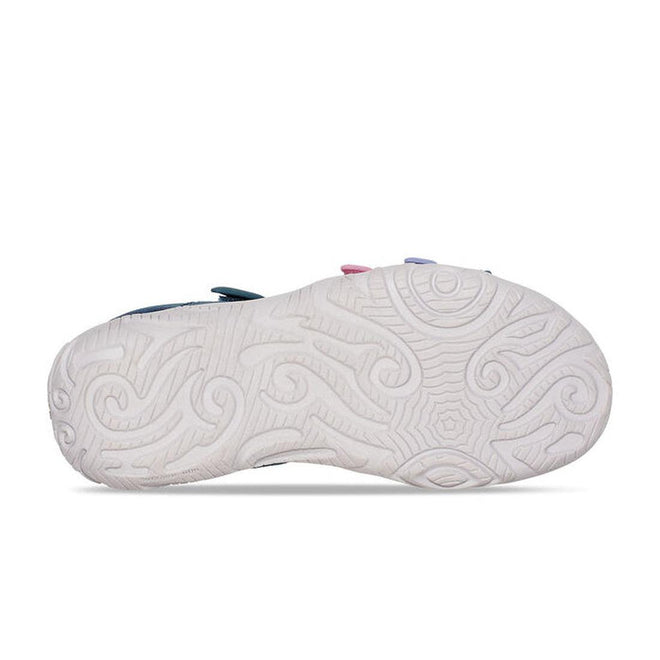 The image shows the sole of the Teva Girls Active Sandal K Tirra in Blue Coral Multi, featuring an intricate swirling white rubber tread pattern, with the sandal positioned sole-up to highlight the design., 195719341190, 195719341206, 195719341213, 195719341251, 195719341220, 195719341183, 195719341411, 195719341381, 195719341428, 195719341404