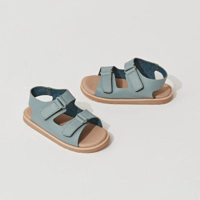 A pair of Pretty Brave WilderSeafoam Blue Kids Sandals (29-31), featuring light blue straps, tan soles, adjustable velcro fastenings, and a lightweight TPR outsole, displayed on a white background. CLEARANCE - NOT RETURNABLE., 9421036359633, 9421036359640, 9421036359657, 25291, 25292, 25293, 25294