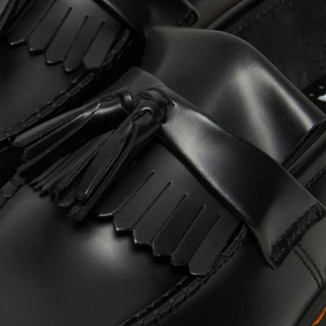 Close-up of Dr Martens Adrian Bex Black Smooth Platform Loafer Shoes, featuring a decorative fringe and tassel on the upper and a durable Goodyear-welted platform sole., 183681, 190665420241, 190665420166, 190665420173, 190665420180, 190665420197, 190665420203, 190665420210, 190665420227