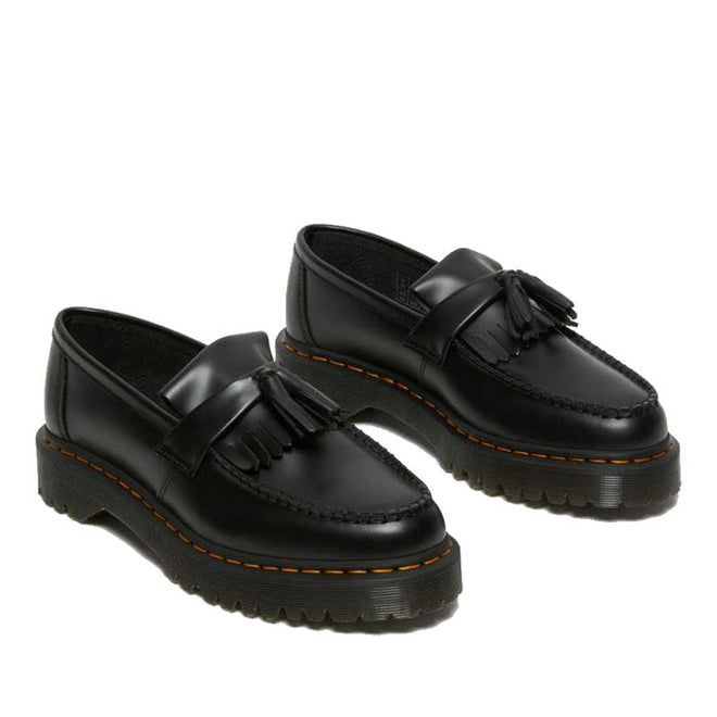 The Dr Martens Adrian Bex Black Smooth Platform Loafer Shoes feature chunky soles, decorative tassels, Goodyear-welted construction, and signature yellow stitching. Now on CLEARANCE., 183681, 190665420241, 190665420166, 190665420173, 190665420180, 190665420197, 190665420203, 190665420210, 190665420227