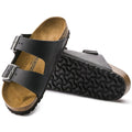 a pair of Birkenstock Arizona Oiled Leather Black Regular Width with double straps, one over the foot and one over the toes with buckle adjustment. Staps are linked at the sides of the foot. Leather thick straps and a suede leather footbed,