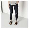 Front view of a women wearing a pair of black birko flor ariana sandals 4013871009641,4013871010524,4013871045205,4013871057956,4013871059875,4013871064275,4013871072706,4013871073390,,,,,
