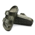 a pair of Birkenstock Arizona EVA Khaki Regular Width with double straps, one over the foot and one over the toes with buckle adjustment. Staps are linked at the sides of the foot. Made of EVA a plastic like material, suitable fot being around water
