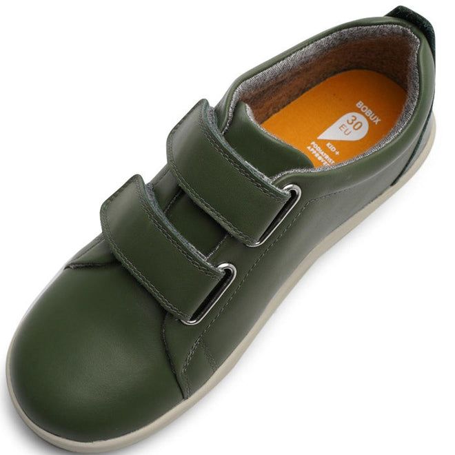 The Bobux Kids + Plus Grass Court Forest Green Velcro Trainer 832463 features double Velcro straps, a cotton knit lining, a light brown insole marked 30 EU, and a light-colored sole—shown from above., 9420071320714, 9420071320721, 9420071320738, 9420071320745, 28512, 28513, 28514