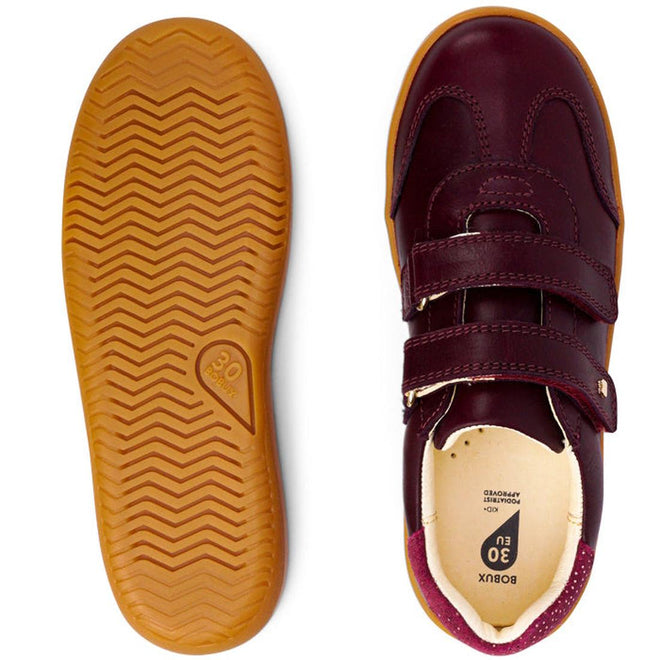 The Bobux Kids Plus KP Sprite Sneaker in Boysenberry features a maroon leather upper, brown rubber soles with zigzag tread, double hook-and-loop straps, and reinforced toe and heel—shown from both top and bottom views., 29968, 9420071316663, 9420071316670, 9420071316687, 9420071316694, 9420071316700, 9420071316717