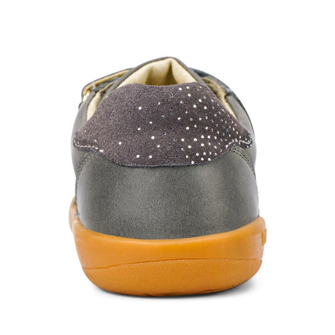 A close-up rear view of the Bobux Kids Plus KP Sprite Sneaker in Charcoal Grey—unisex shoes with a gray upper, suede heel with white polka dots, and a light brown rubber sole, perfect leather sneakers for winter 2023., 9420071316724, 9420071316731, 9420071316748, 9420071316755, 28331, 28332, 28333