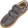 The Bobux Kids Plus KP Sprite Sneaker Charcoal Grey features two Velcro straps, a tan rubber sole, and a light inner lining—seen from above at an angle—making it an ideal unisex choice for winter 2023., 9420071316724, 9420071316731, 9420071316748, 9420071316755, 28331, 28332, 28333