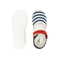 Top view of the Bobux Kid + KP Twist Open Toe Sandal Navy, showcasing premium leather in navy and white stripes, a red strap with gold buckle, closed back heel support, and a white sole. The left shoe is upright; the right shows its tread., 9420068530331, 9420068530348, 9420068530355, 9420068530362, 9420068530379, 24131, 24132