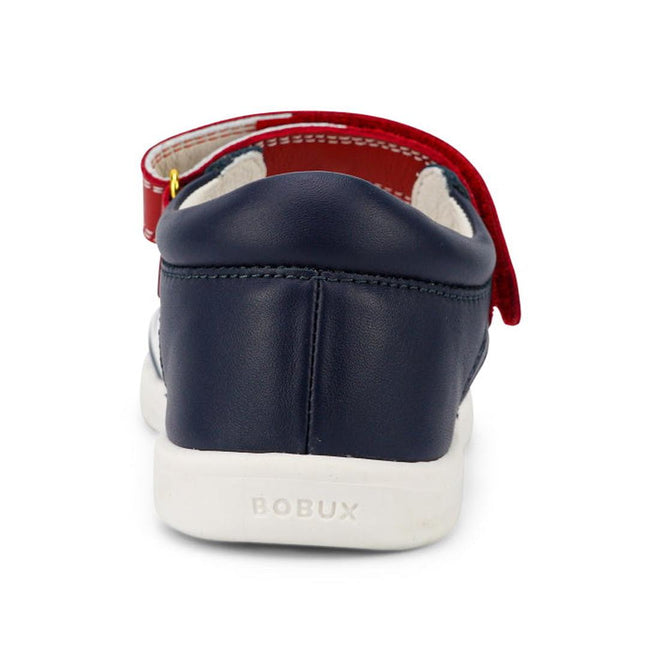A close-up rear view of the Bobux Kid + KP Twist Open Toe Sandal Navy shows its closed back heel support, white sole, red Velcro strap, and BOBUX embossed on the heel., 9420068530331, 9420068530348, 9420068530355, 9420068530362, 9420068530379, 24131, 24132