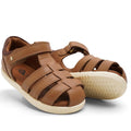 a pair of Bobux IWalk Roam Sandal Caramel Toffee Leather Sandal- closed toe sandals with closed back for heel support. velcro around the heel and straps of leather over the toes so air can move freely around the toes.