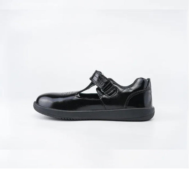The Bobux Kid+ Black School Patent Leather Shoe Brave T-Bar is a girls’ school shoe with a rounded toe and single Velcro strap, shown on a white background., 9420068510845, 9420068510852, 9420068510869, 9420068510876, 9420068510883, 9420068510890, 9420068510906