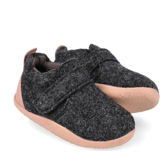 The Bobux Xplorer XP Marvel Felt Charcoal Pink baby shoes, featuring dark gray natural felt, light pink flexible soles, a scuff-resistant toe cap, and a Velcro strap, are shown side by side on a white background.