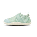 A single Bobux XP Xplorer Marvel Mist Blue Dress Shoe First Walker 501227 with a soft upper, closed toe, and a diagonal strap, shown in profile facing left against a white background., 9420071309627, 9420071309634, 9420071309641