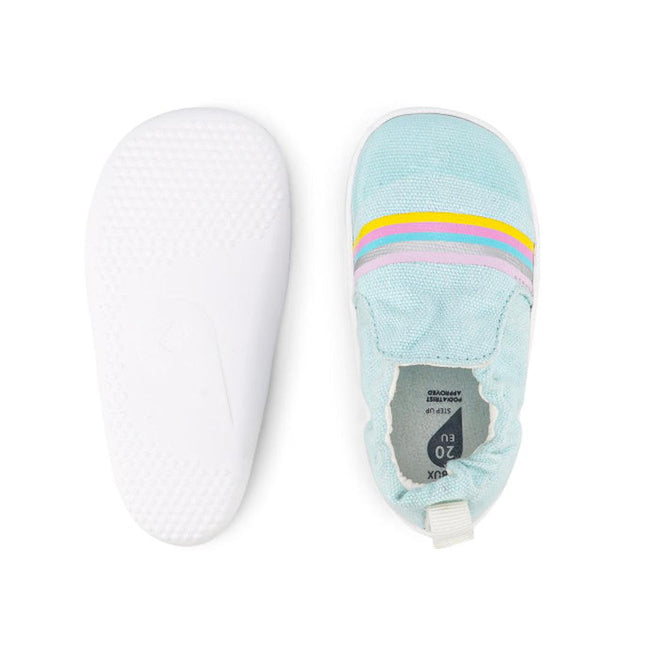 The Bobux Xplorer Scamp Crawler Aqua Silver Rainbow 501709 features a vegan-friendly light blue canvas upper with yellow, pink, and purple stripes, plus a white flexible sole—shown with one shoe top view and one bottom view., 9420068534384, 9420068534391, 9420068534407, 9420068534414