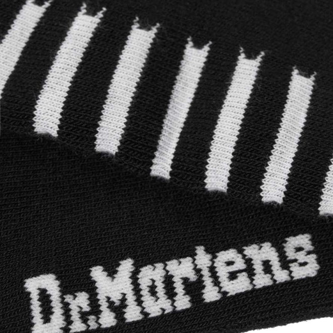 Close-up of the Dr Martens Socks Double Doc Sock Unisex in black with white horizontal stripes and the Dr. Martens logo in white. The knit texture suggests arch support and blister protection for added comfort and style., 190665377309, 190665377293