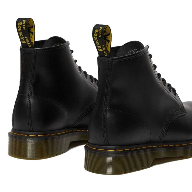 a rear, heel shot of a pare of Dr Martens 101 6 eye boots in black. Shows pull tab on heel and stitching re enforcing on the heel.,
190665350715,
190665350722,
190665350739,
190665350746,
190665350753,
190665350760,
190665350777,
190665350784,
190665350791,
190665350807,
190665350814,