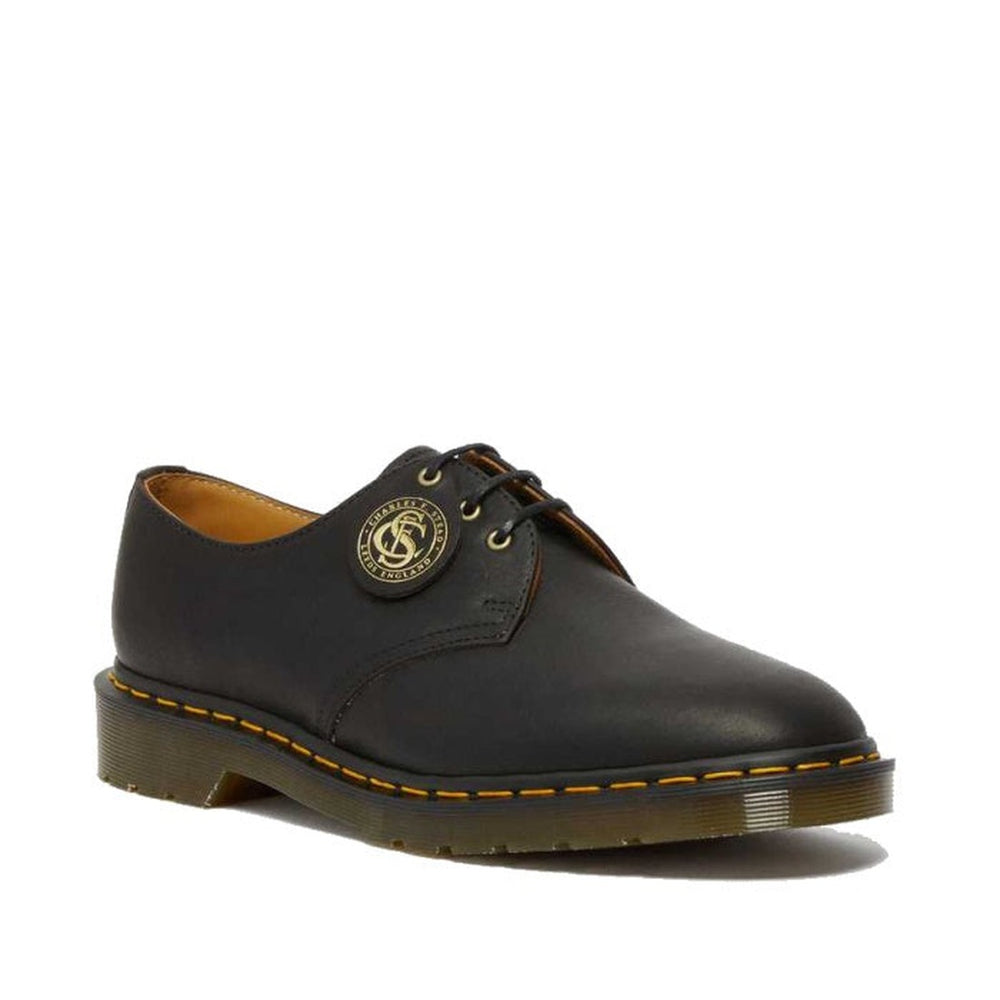 Image of right foot, side on of Dr Martens Made In England Oil Leather 1461 3 Eye Shoes-Foot Forward Shoes