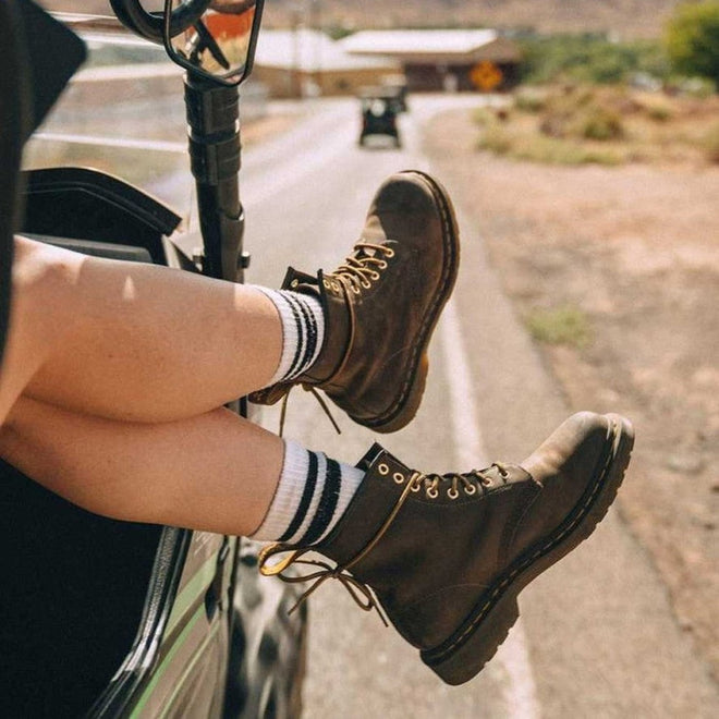 person wearing brown boots in an open vechile with the egs and feet out the window,
800090827903,
800090827927,
800090796971,
800090796995,
800090827972,
800090797008,
800090797015,
800090797039,
800090797046,
800090797053,