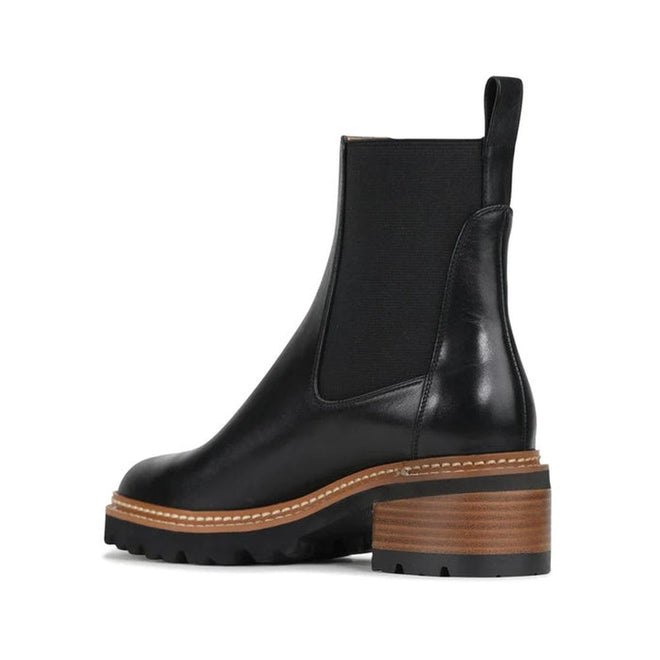 9321191079011,
9321191079028,
9321191079035,
9321191079042,
9321191079059,
9321191079066,
9321191079004,

EOS Linear women’s boot in Black leather with side gussets, block heel, and lugged sole. Side View of Right Foot taken from the heel showing heel detailing on the inside of the leg.