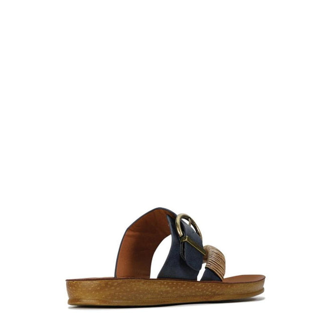 The Los Cabos Bria Blue Light Flexible Sandal Jandal Navy features a wooden sole, navy strap, large gold buckle, and braided tan accent—stylish women's summer sandals shown from the side on a white background., 236222, 9321191161815, 9321191161822, 9321191161839, 9321191161846, 9321191161853, 9321191161860