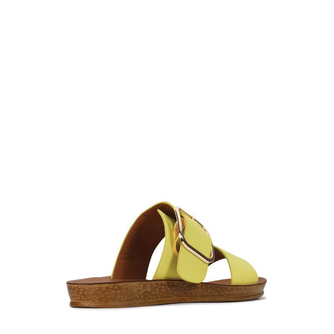 The Los Cabos Doti Citrus Yellow Light Flexible Sandal features a cork sole, brown footbed, and wide leather strap with a large gold buckle—perfect for sunny days. Women's style shown from the side. CLEARANCE NOT RETURNABLE., 23673, 23674, 23675, 23676, 23677, 23678, 23679