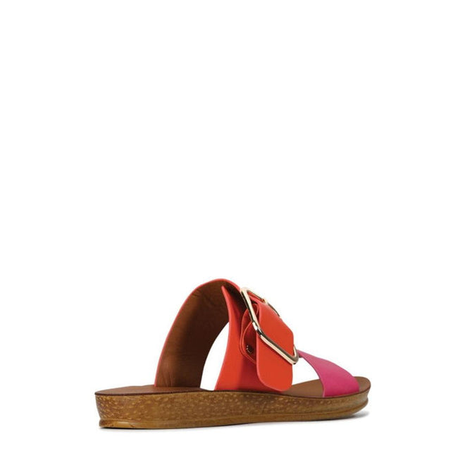 The Los Cabos Doti Pink/Orange Light Flexible Sandal features wide pink and orange straps, a large gold side buckle, and a flat textured brown sole. Ideal for women wanting comfort and style. Displayed on a plain white background., 9321191058962, 9321191058979, 9321191058986, 9321191058993, 9321191059006, 9321191059013, 9321191059020