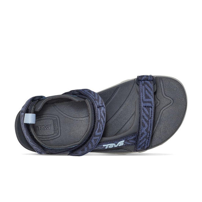 A single Teva Boys Active Rugged Sandal K Tanza Blue, shown from the top and side to highlight its blue quick-dry adjustable webbing straps, black design details, and contoured footbed., 194715413832, 194715413887, 194715413856, 194715413801, 194715413818, 194715413825, 194715413894, 194715413931, 194715413948, 194715413924