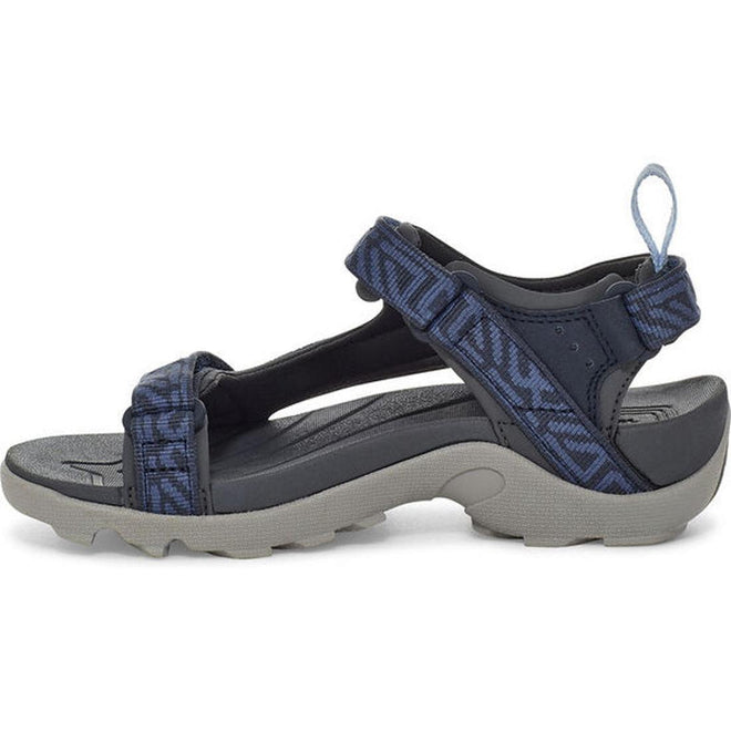 The Teva Boys Active Rugged Sandal K Tanza Blue is a navy and gray sport sandal with adjustable recycled polyester straps, a thick textured sole, and heel pull loop, shown against a white background., 194715413832, 194715413887, 194715413856, 194715413801, 194715413818, 194715413825, 194715413894, 194715413931, 194715413948, 194715413924